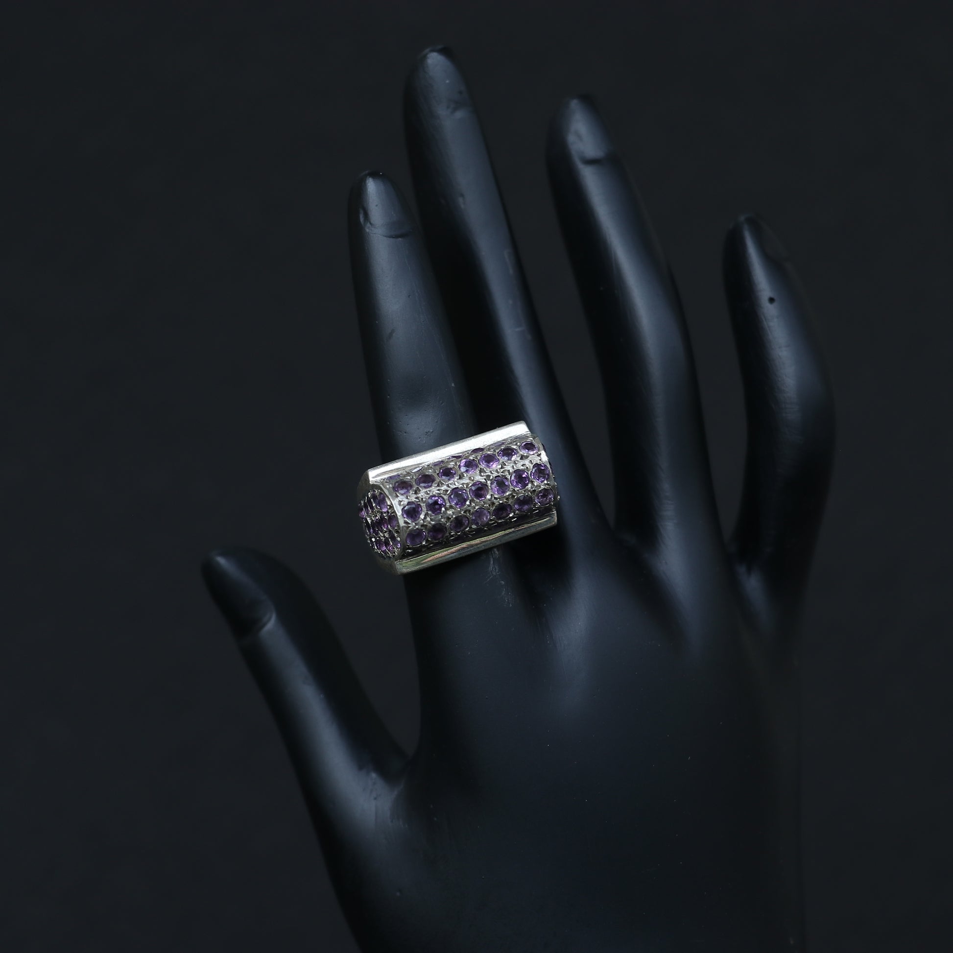 SILVER RING SET IN SMALL AMETHYSTS