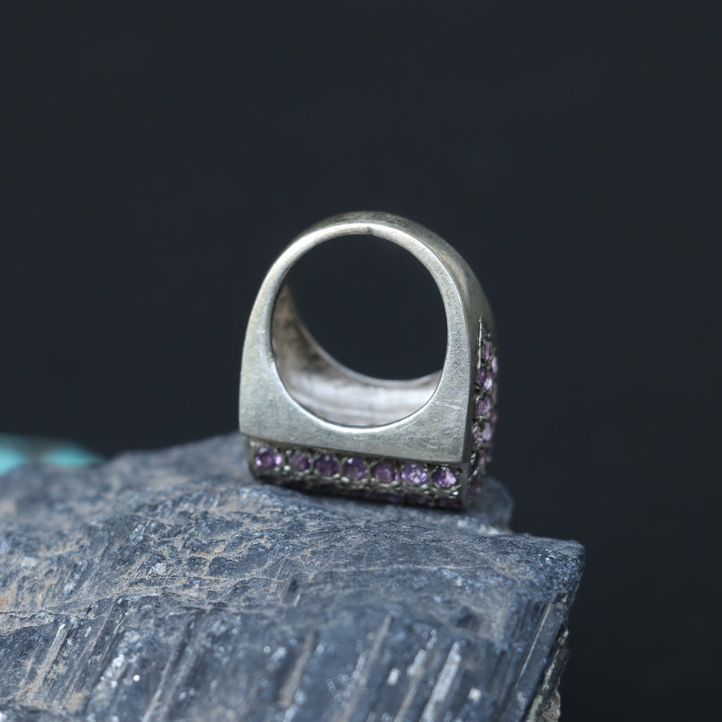 SILVER RING SET IN SMALL AMETHYSTS