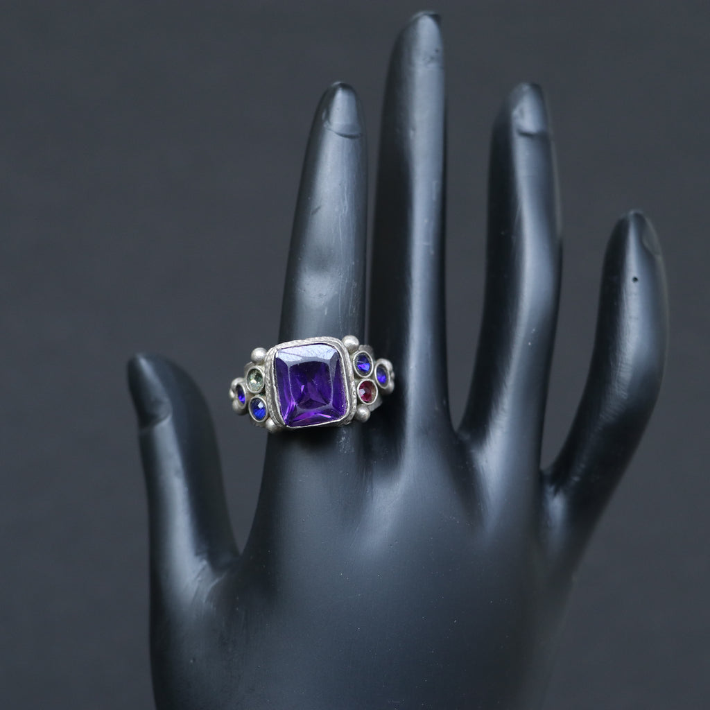 VINTAGE SILVER RING WITH A PURPLE GLASS STONE