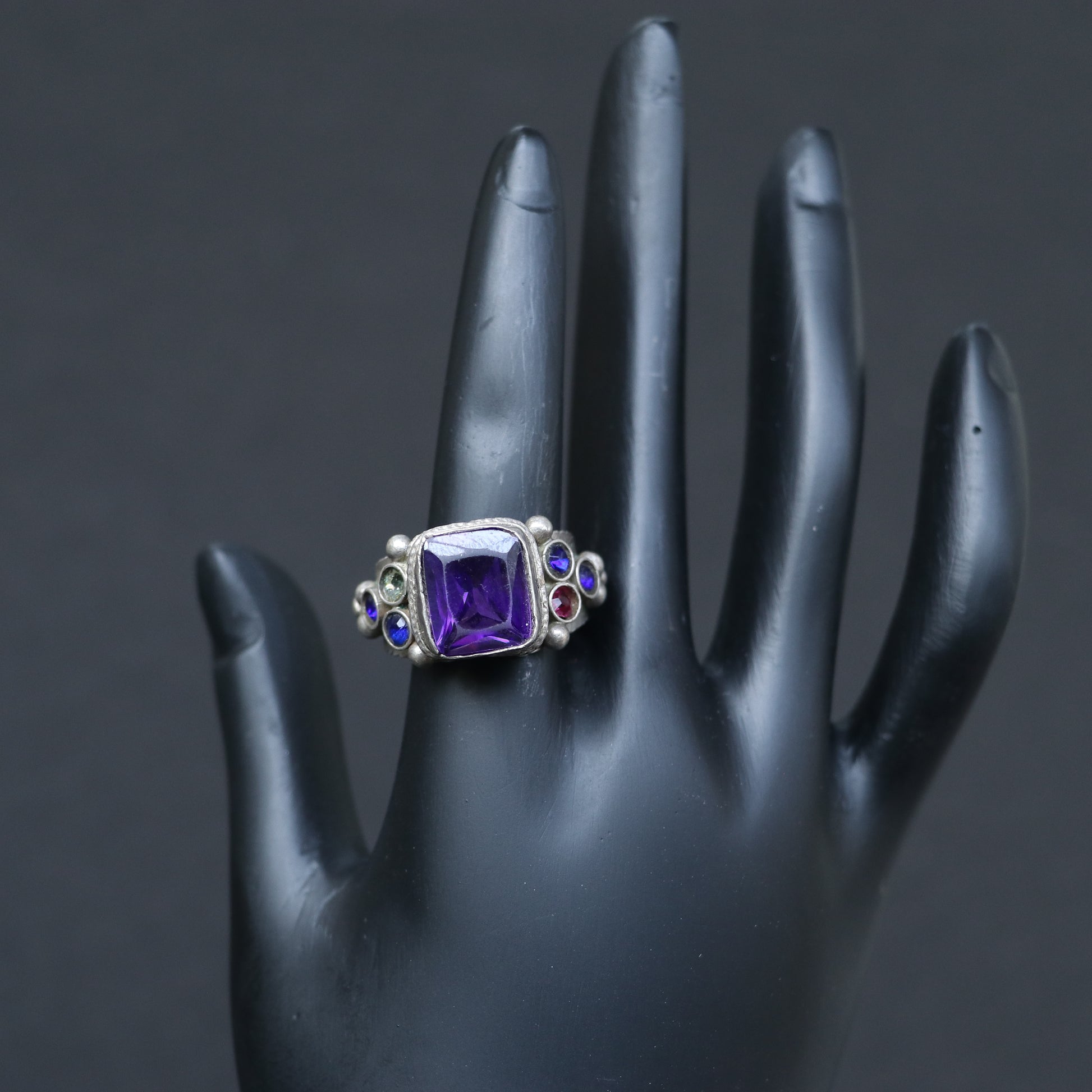 VINTAGE SILVER RING WITH A PURPLE GLASS STONE