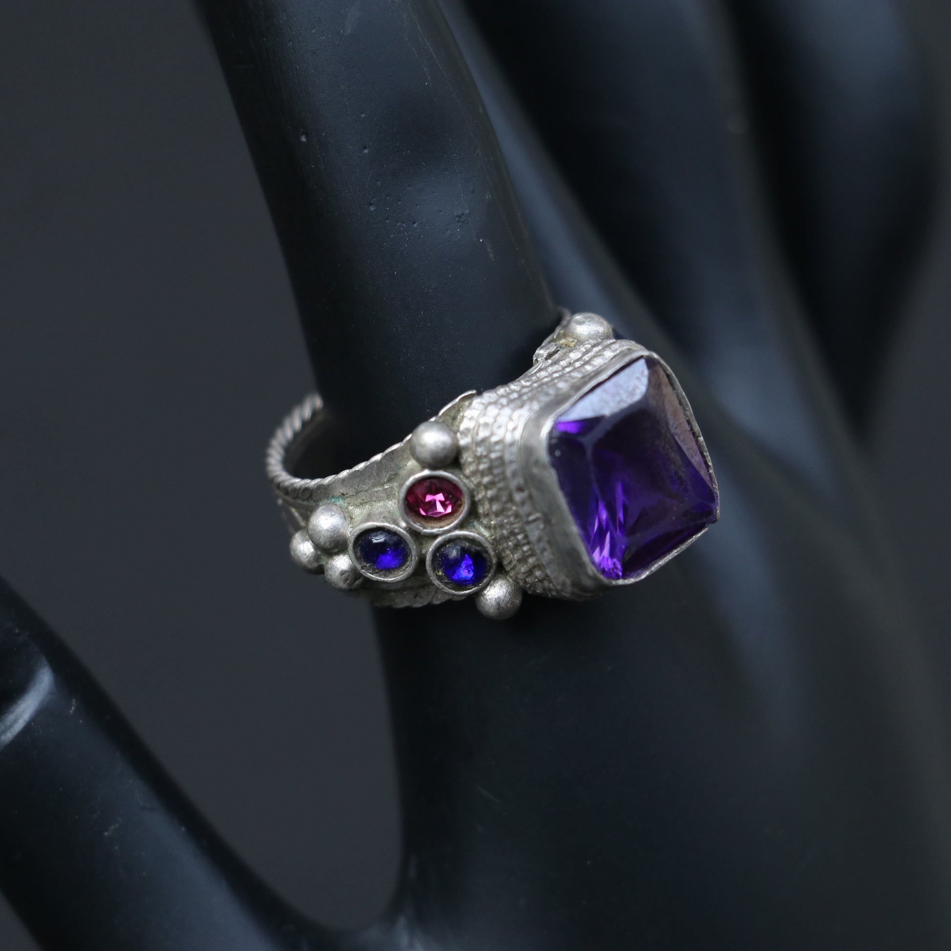 VINTAGE SILVER RING WITH A PURPLE GLASS STONE