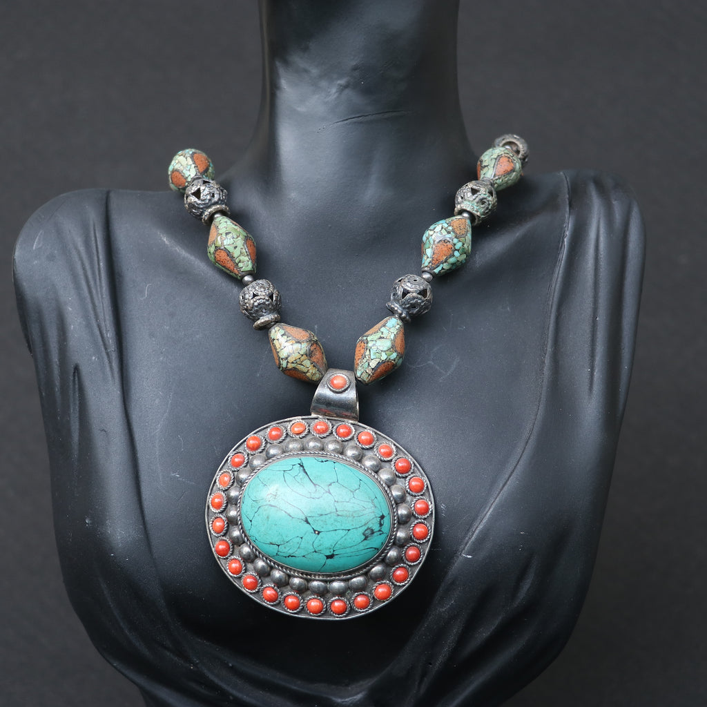TRIBAL NECKLACE WITH TURQUOISE AND CORAL BEEDS , FEATURING A LARGE TURQUOISE PENDANT