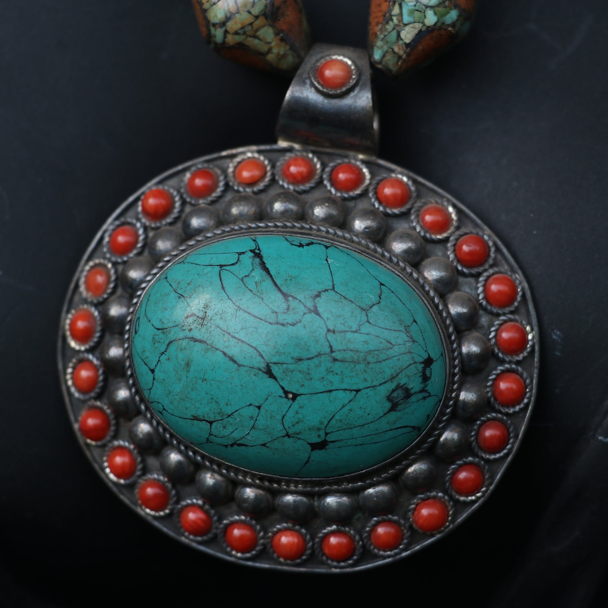TRIBAL NECKLACE WITH TURQUOISE AND CORAL BEEDS , FEATURING A LARGE TURQUOISE PENDANT