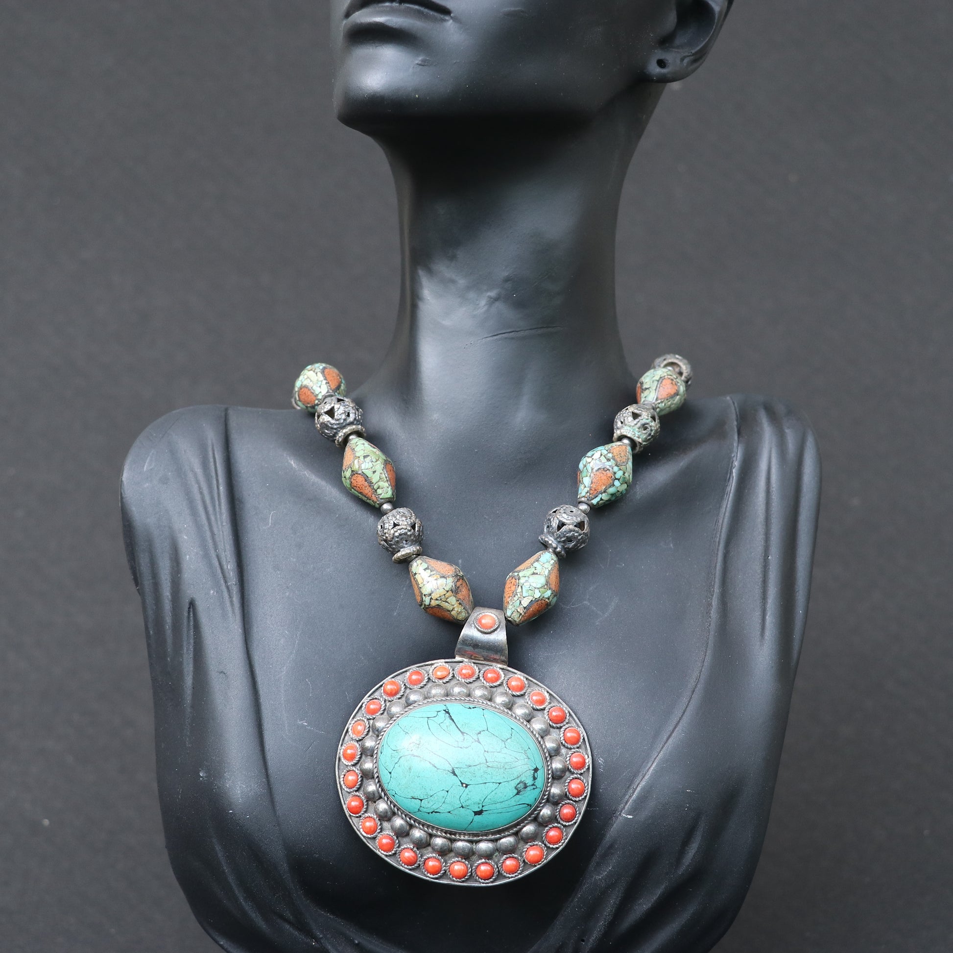 TRIBAL NECKLACE WITH TURQUOISE AND CORAL BEEDS , FEATURING A LARGE TURQUOISE PENDANT