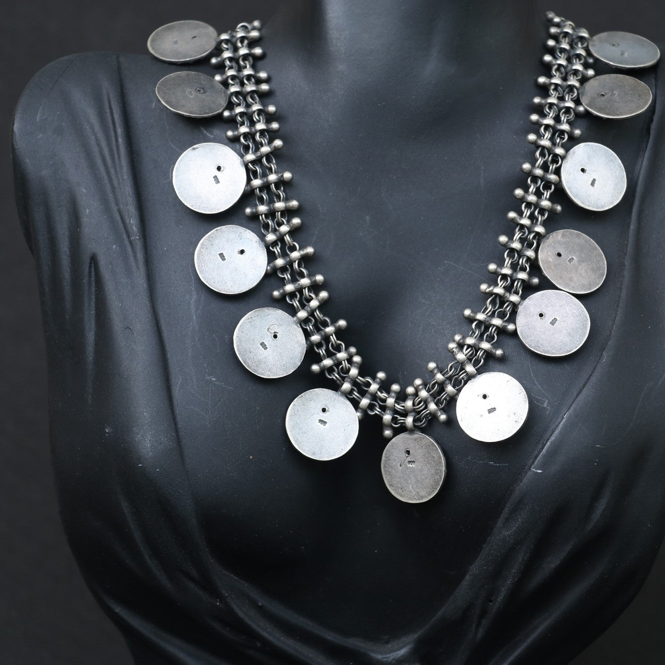 SILVER NECKLACE WITH LAYERED CHAIN DESIGN AND ENGRAVED COIN SHAPE GANESH