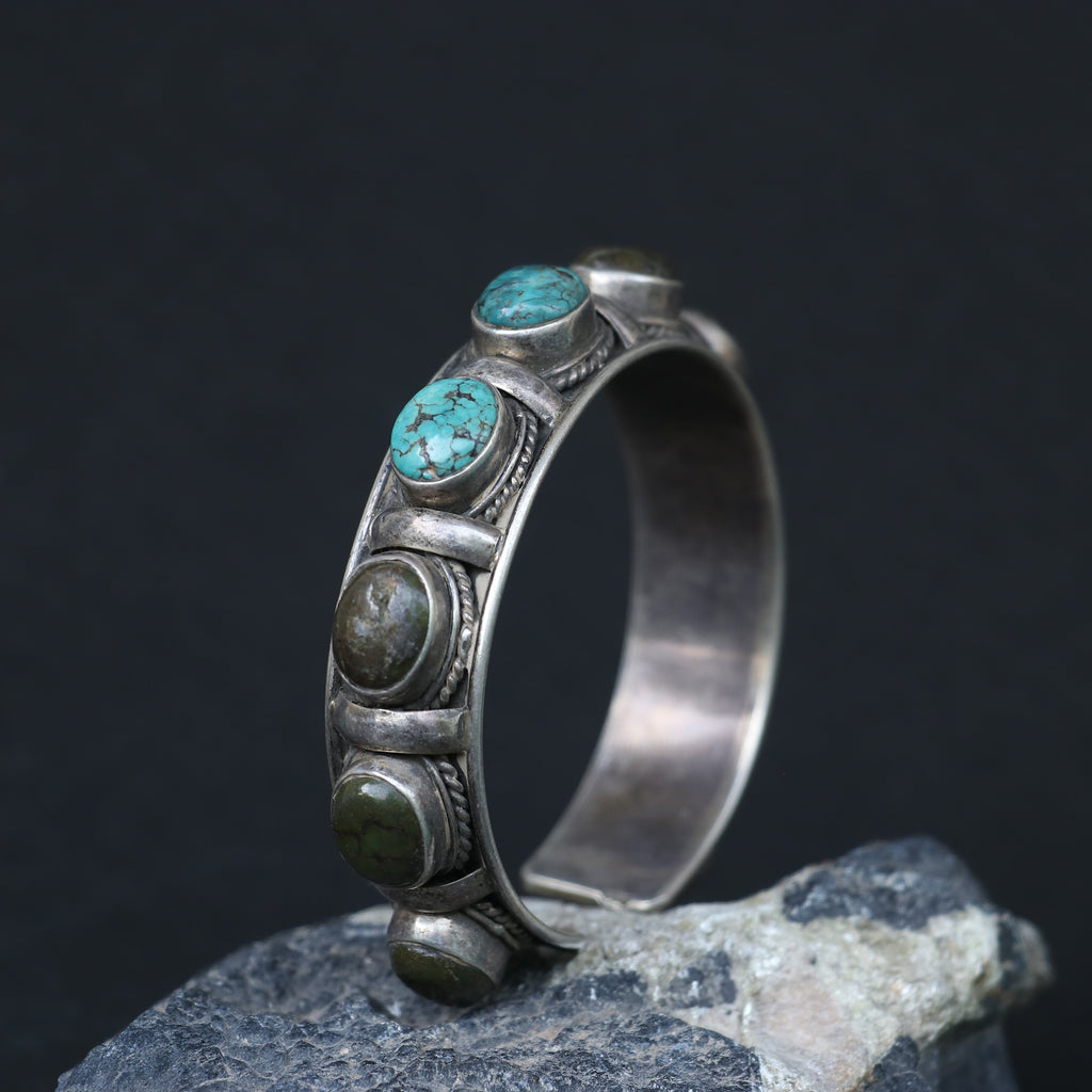 SILVER KADA FEATURING OVAL TURQUOISES AND GREEN GEMSTONES