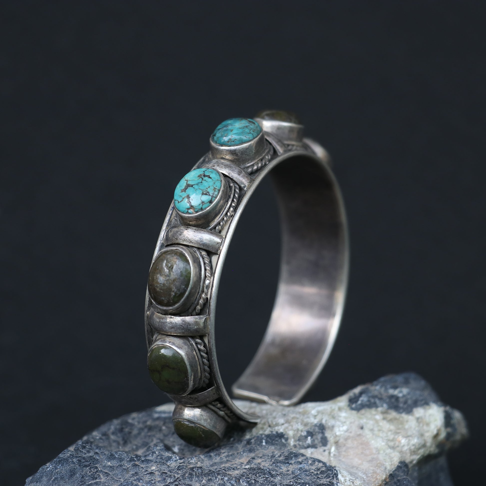 SILVER KADA FEATURING OVAL TURQUOISES AND GREEN GEMSTONES