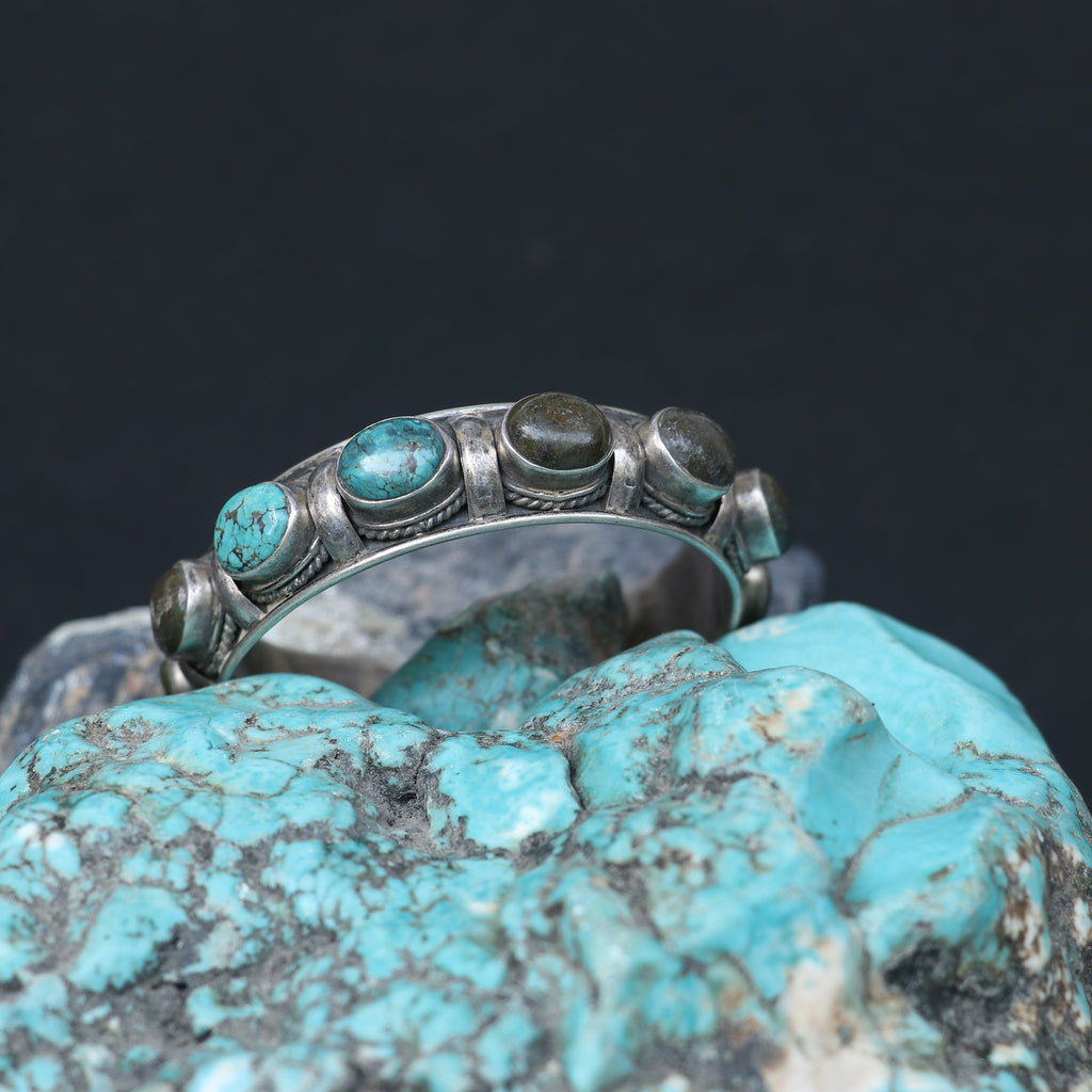 SILVER KADA FEATURING OVAL TURQUOISES AND GREEN GEMSTONES