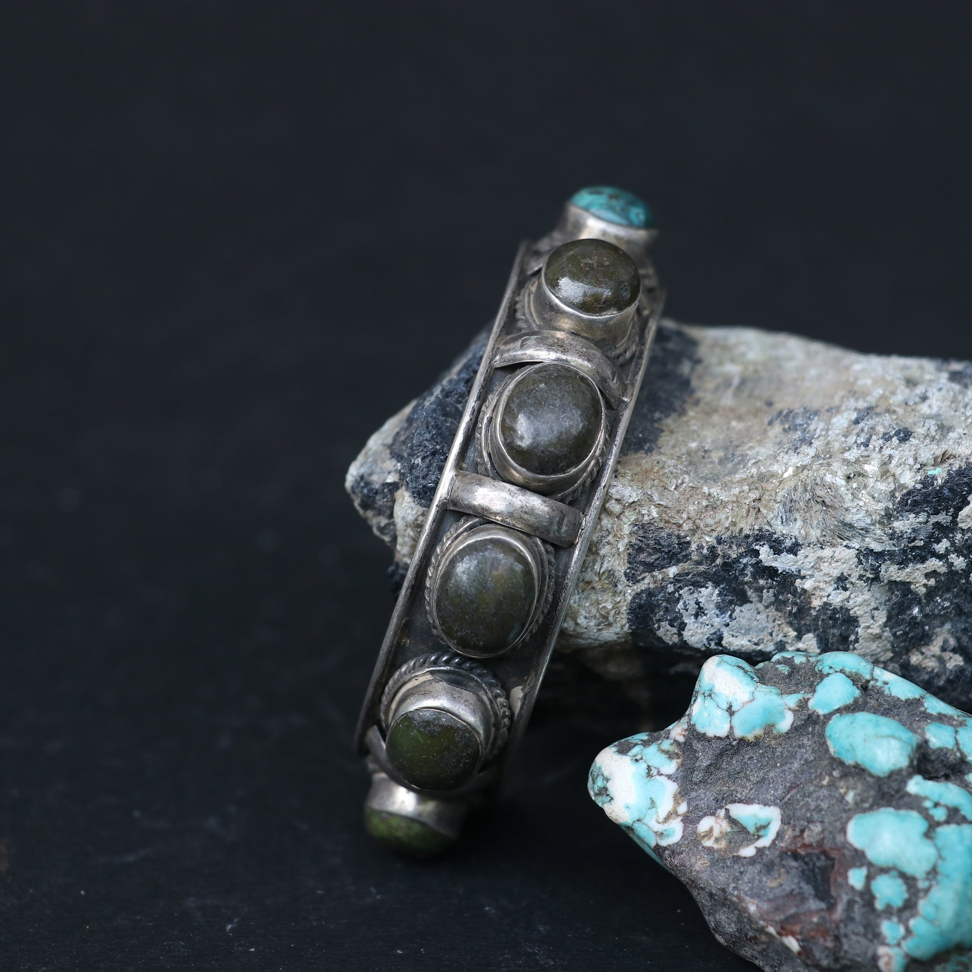 SILVER KADA FEATURING OVAL TURQUOISES AND GREEN GEMSTONES