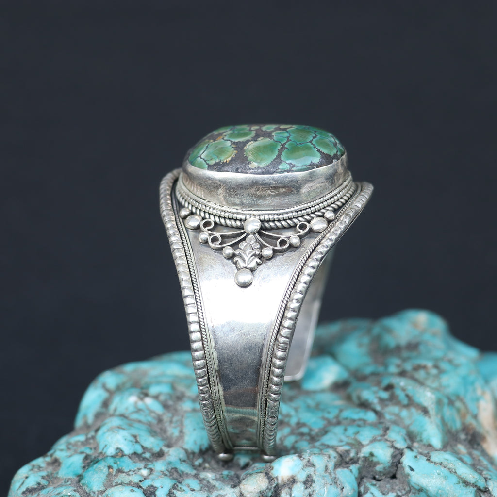 SILVER KADA FEATURING A LARGE TURQUOISE