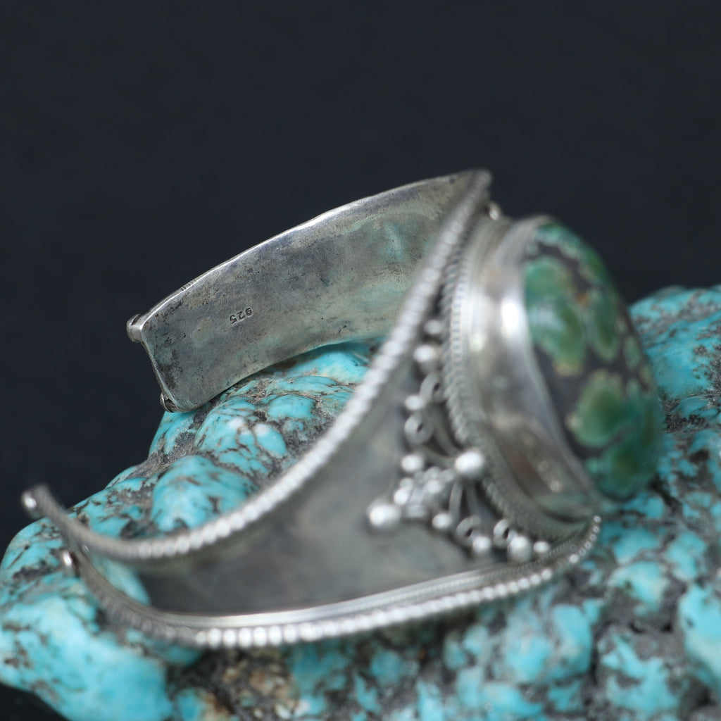 SILVER KADA FEATURING A LARGE TURQUOISE