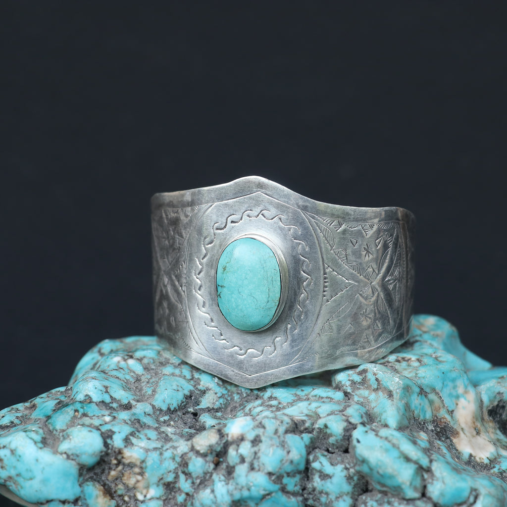 SILVER KADA FEATURING A ROUND TURQUOISE