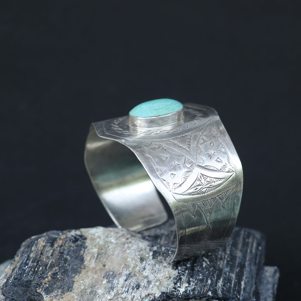 SILVER KADA FEATURING A ROUND TURQUOISE