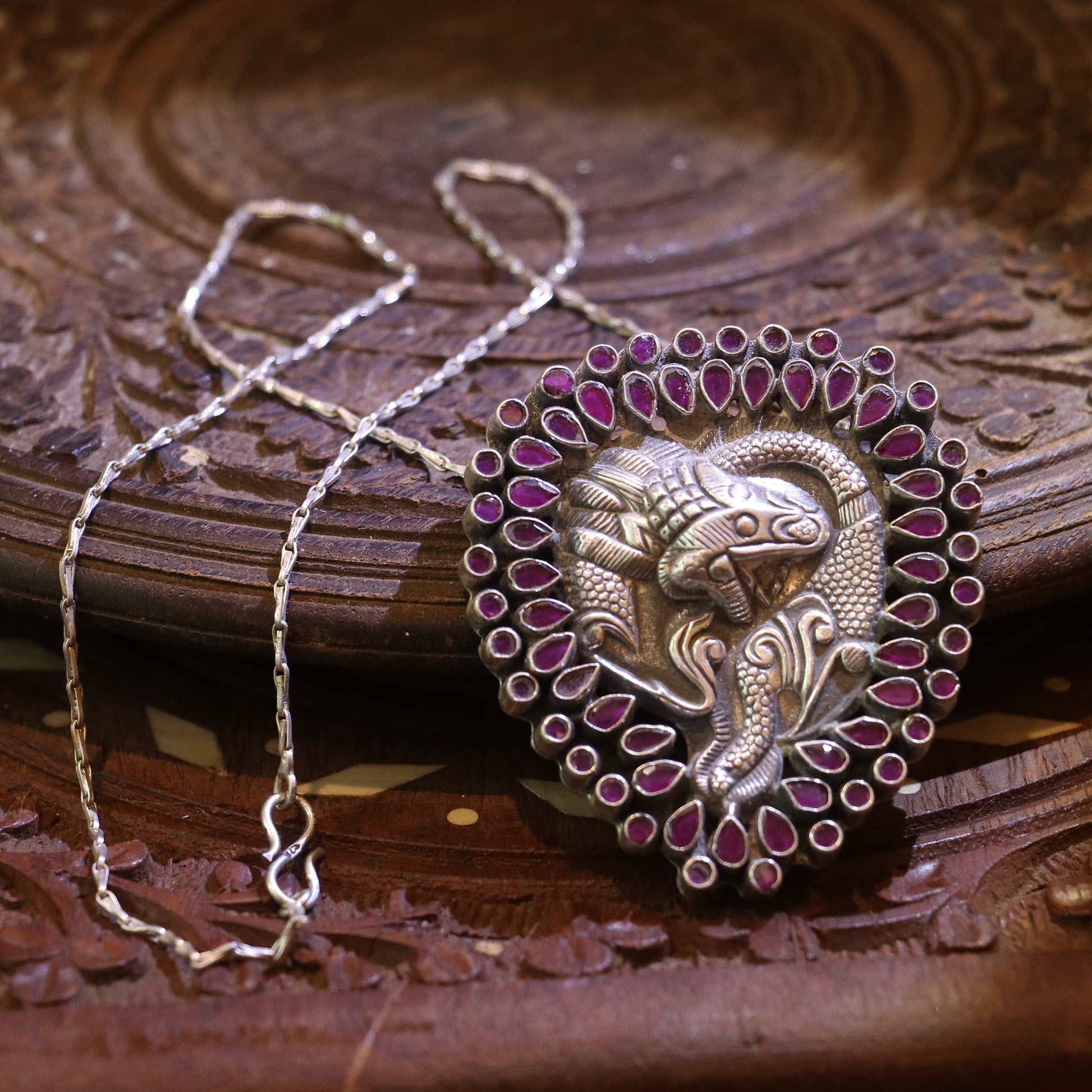SILVER TWIN FISH PENDANT WITH BANGOK RUBY STONES
