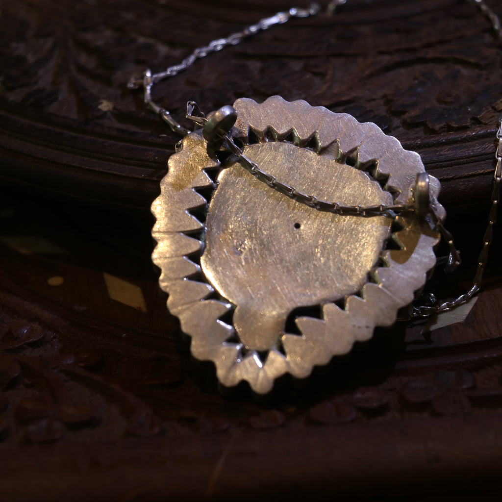 SILVER TWIN FISH PENDANT WITH BANGOK RUBY STONES