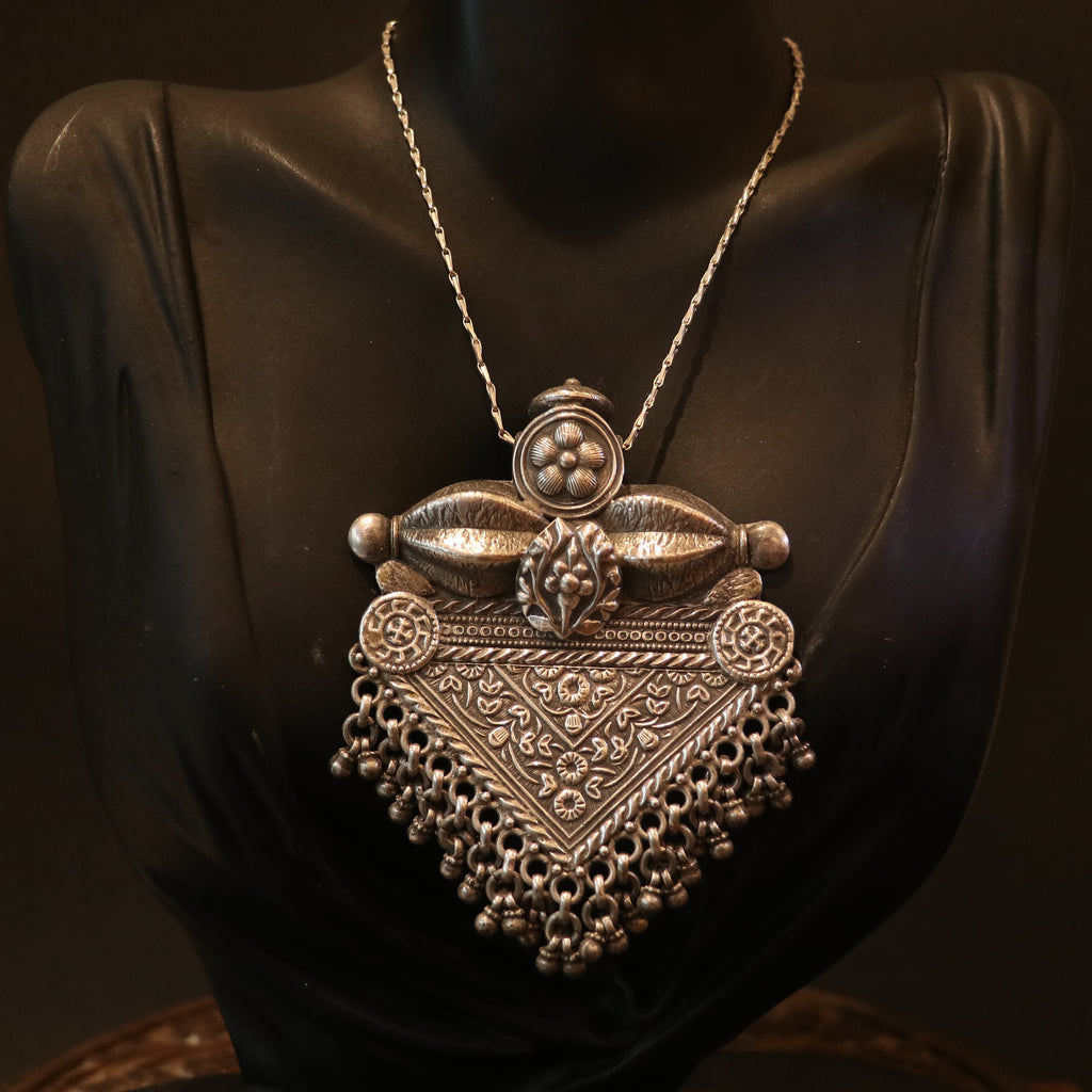 SILVER PENDANT WITH FLORAL CRAVINGS AND HANGING BEADS