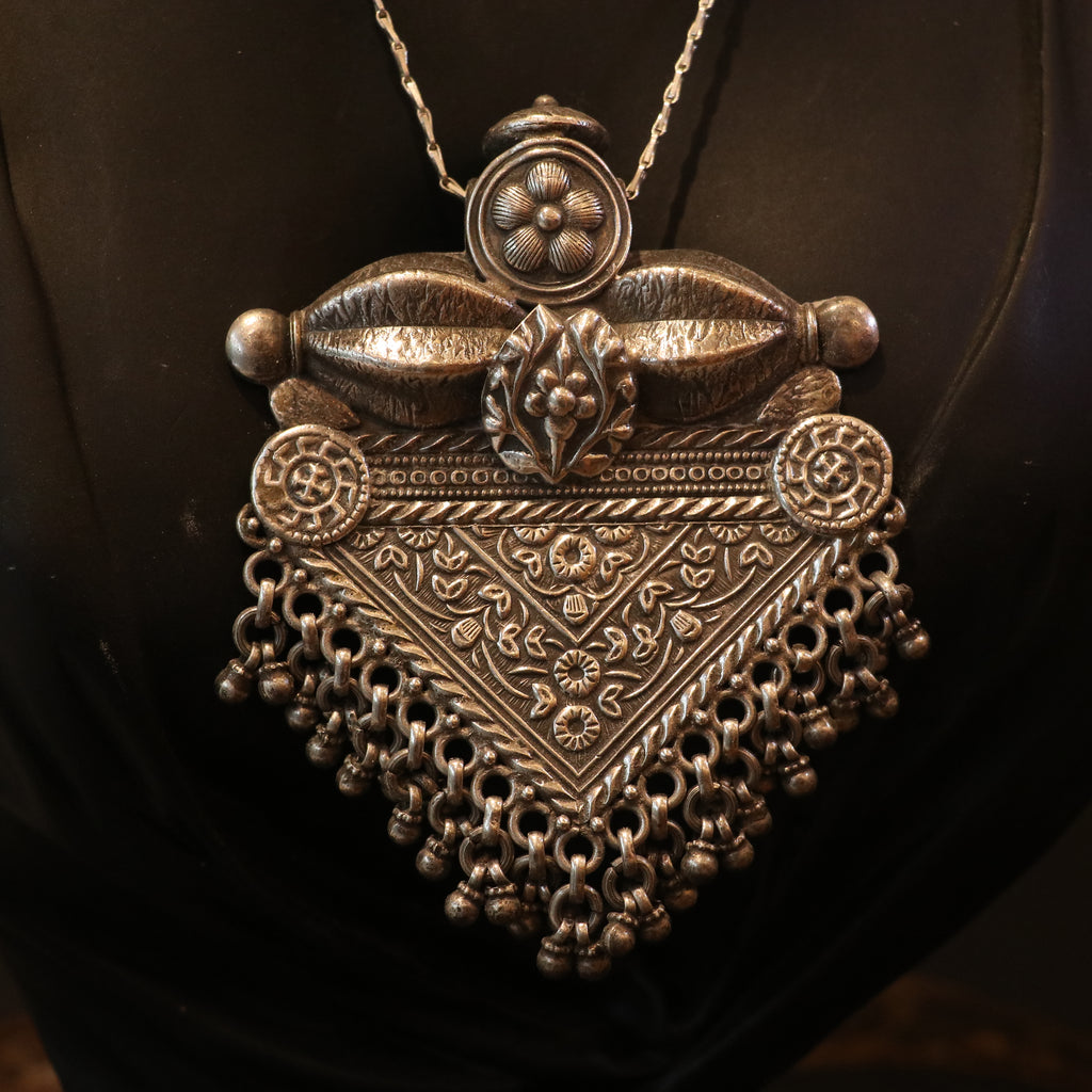 SILVER PENDANT WITH FLORAL CRAVINGS AND HANGING BEADS