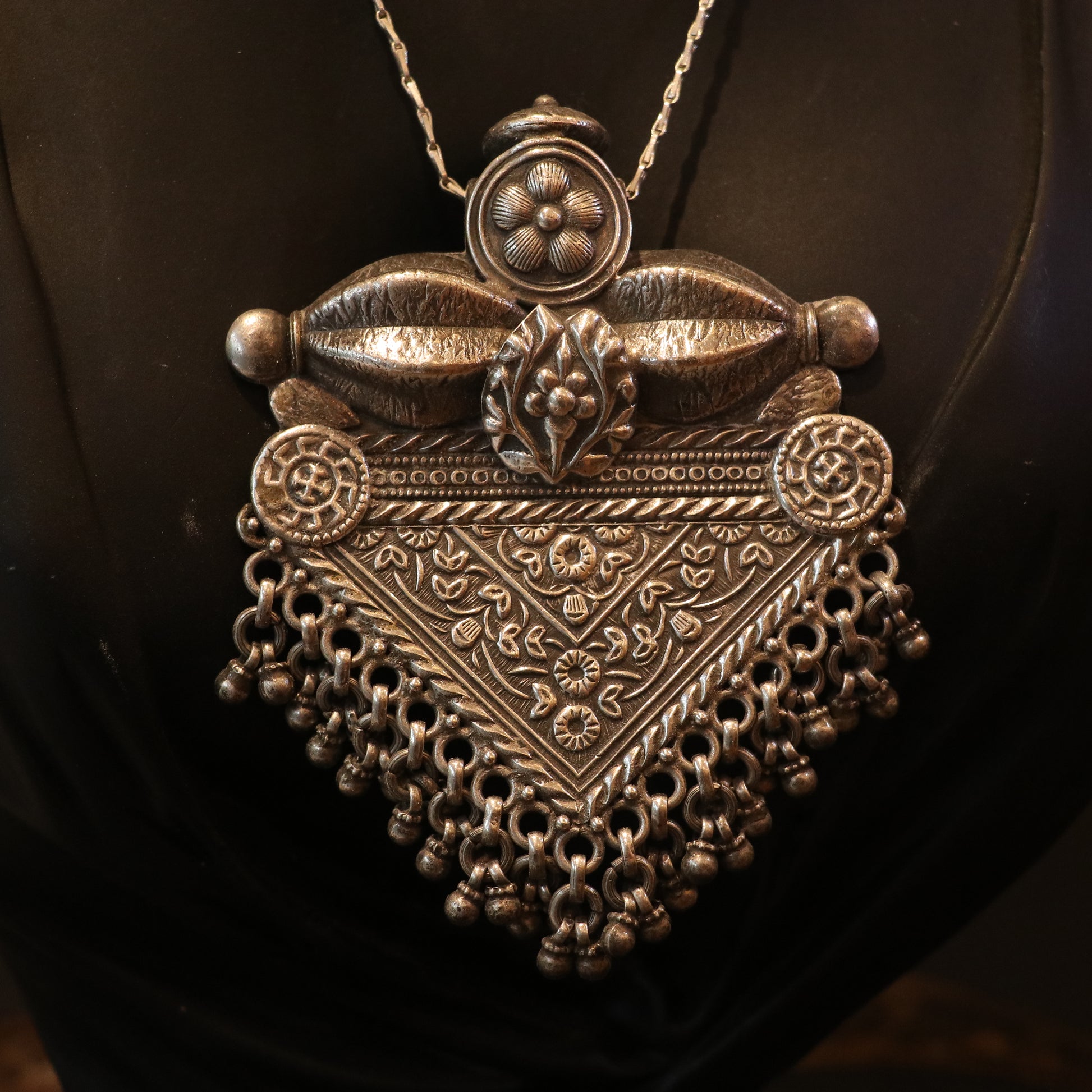 SILVER PENDANT WITH FLORAL CRAVINGS AND HANGING BEADS