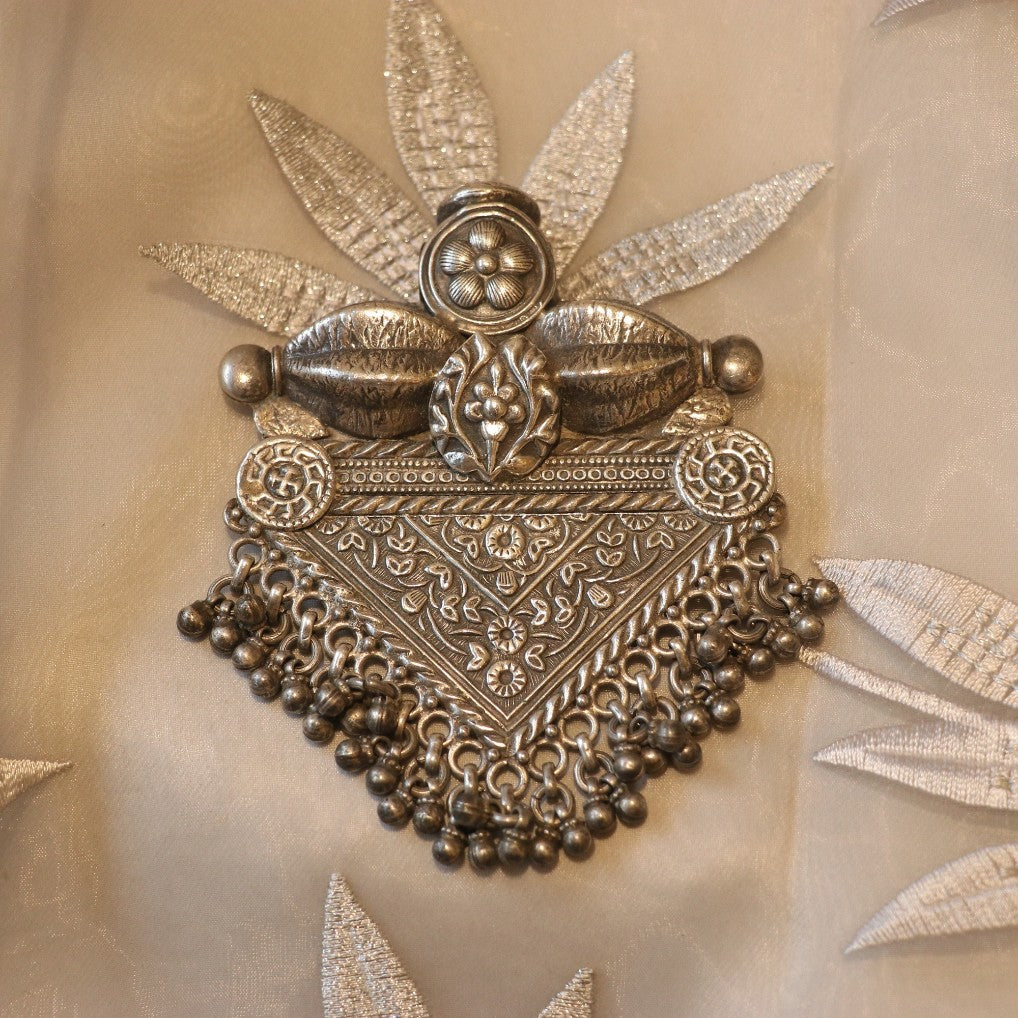 SILVER PENDANT WITH FLORAL CRAVINGS AND HANGING BEADS