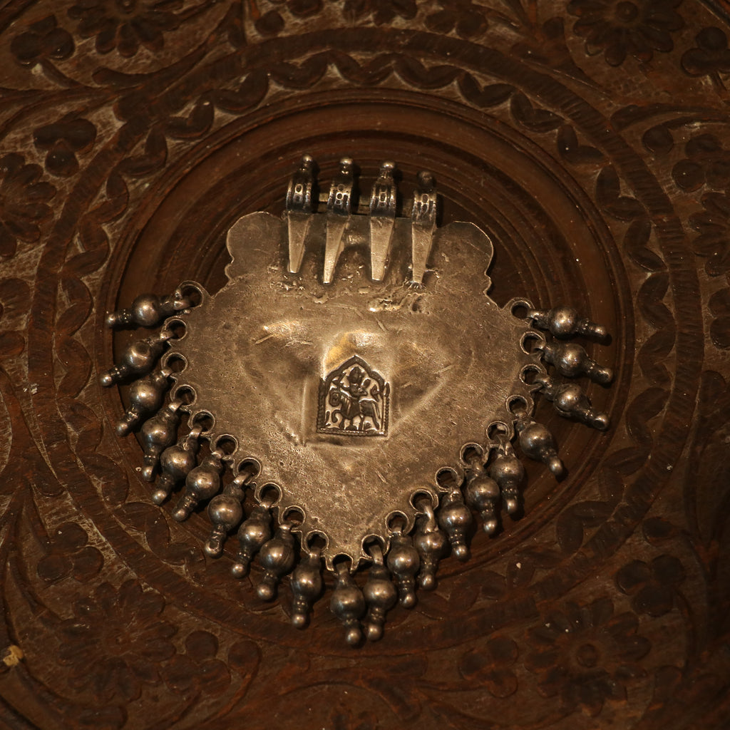 SILVER PENDANT WITH TRIBAL MOTIF , BLUE ACCENTS , AND HANGING BEEDS