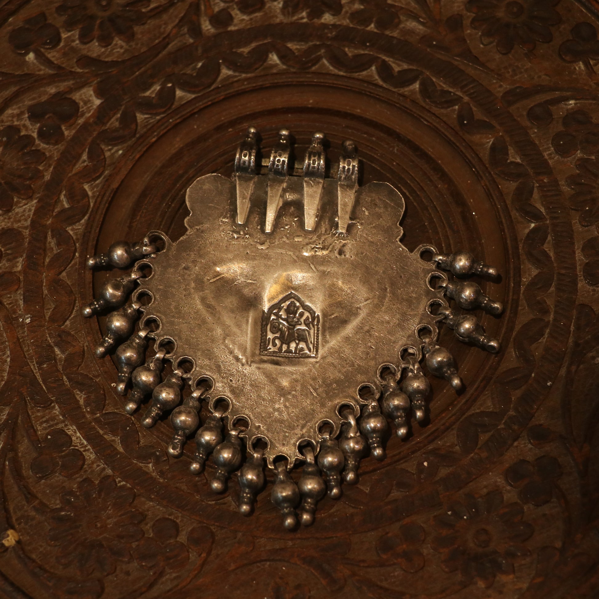 SILVER PENDANT WITH TRIBAL MOTIF , BLUE ACCENTS , AND HANGING BEEDS