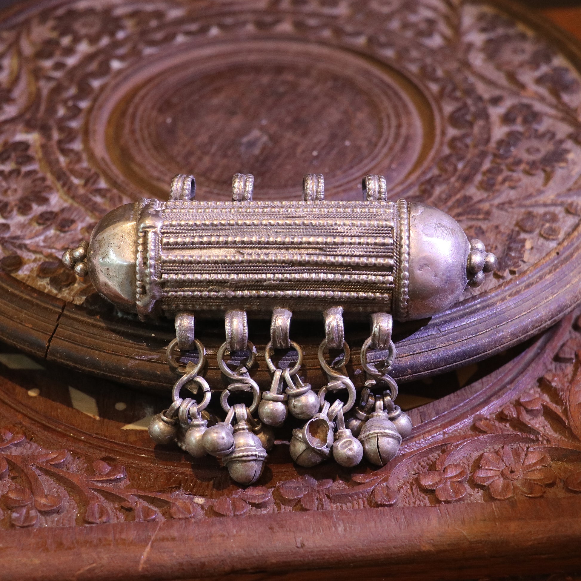 ANTIQUE CYLINDRICAL SILVER AMULET WITH GHUNGROO STYLE BALLS