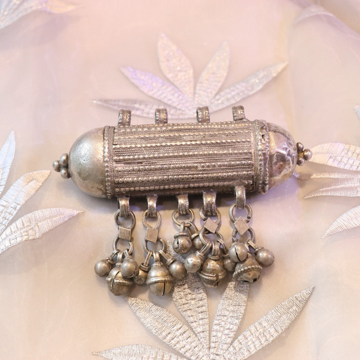 ANTIQUE CYLINDRICAL SILVER AMULET WITH GHUNGROO STYLE BALLS