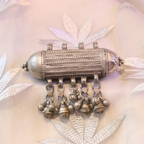 ANTIQUE CYLINDRICAL SILVER AMULET WITH GHUNGROO STYLE BALLS