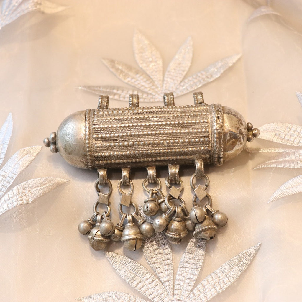 ANTIQUE CYLINDRICAL SILVER AMULET WITH GHUNGROO STYLE BALLS