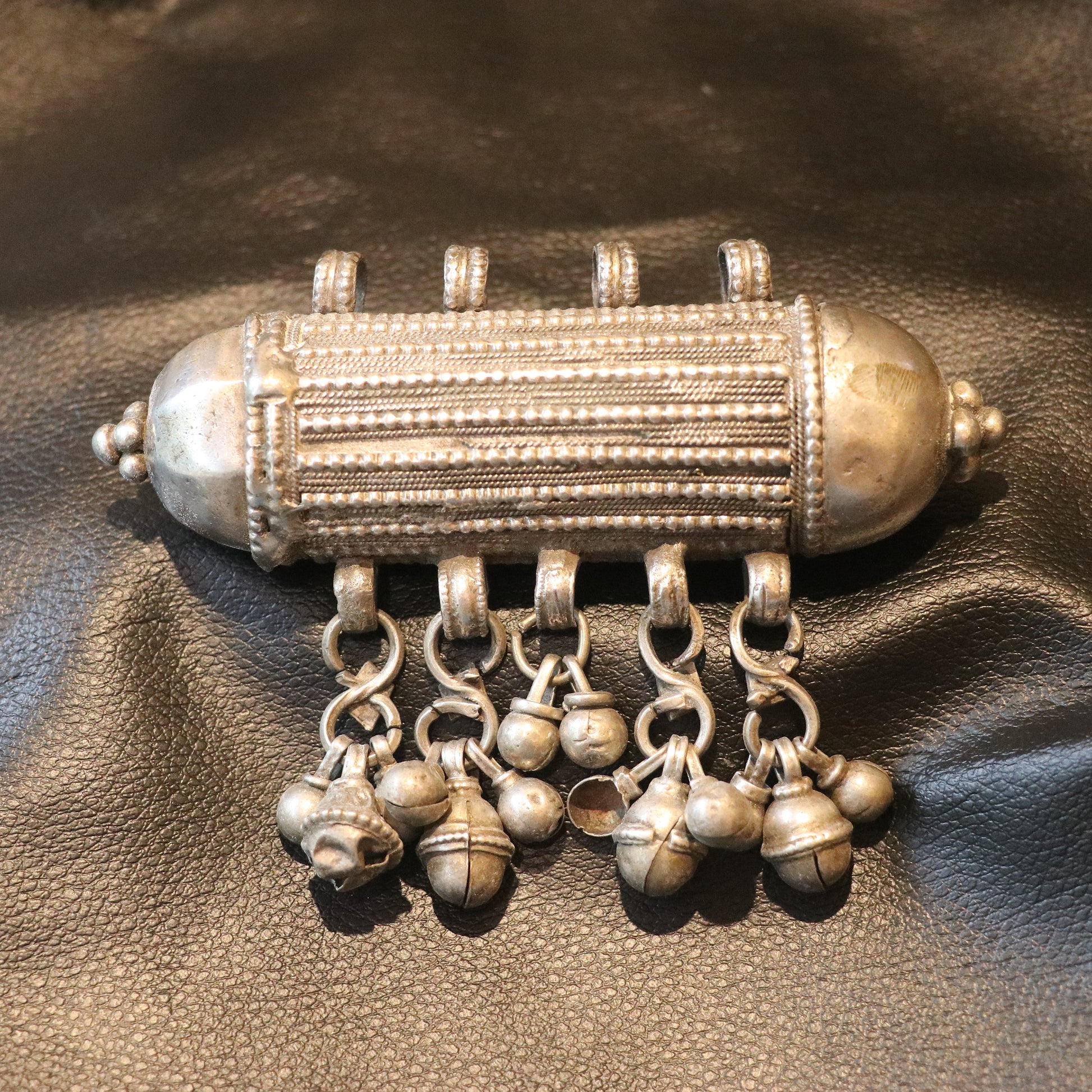 ANTIQUE CYLINDRICAL SILVER AMULET WITH GHUNGROO STYLE BALLS