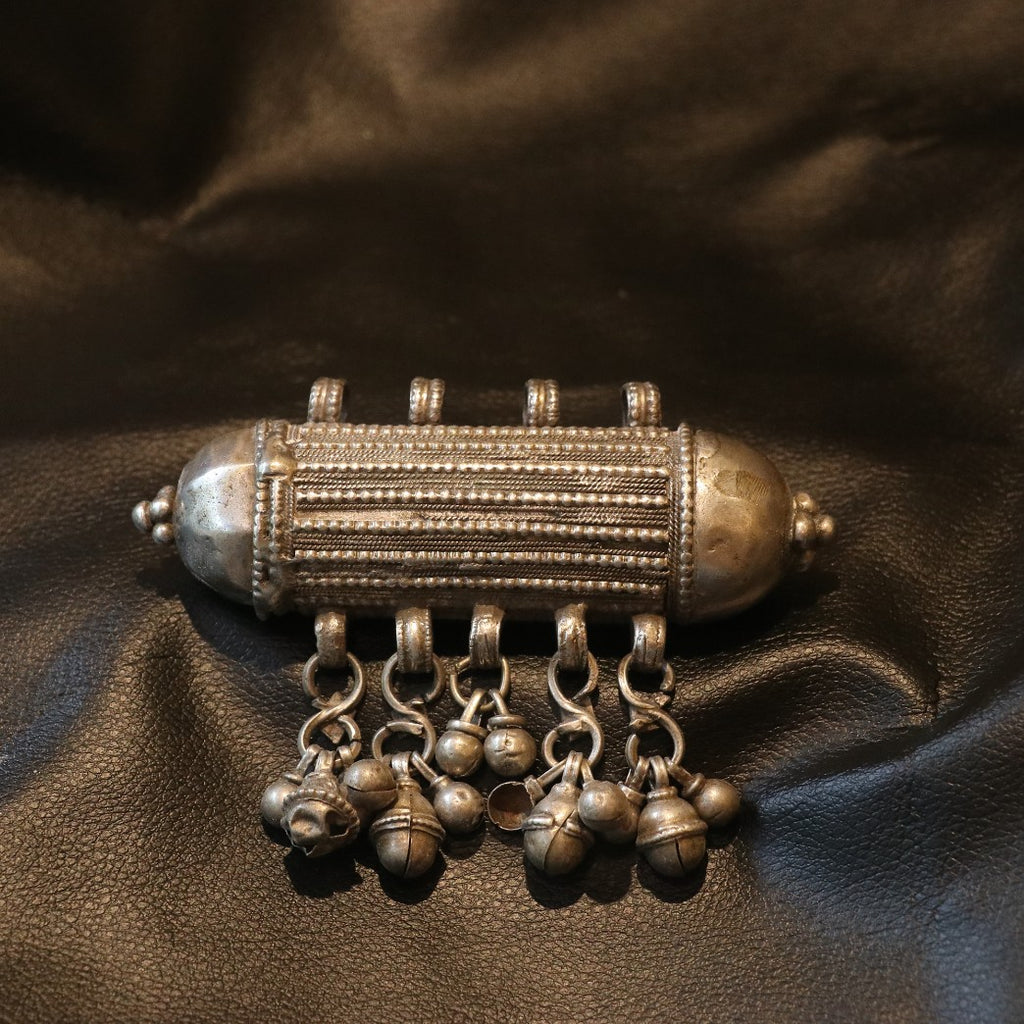 ANTIQUE CYLINDRICAL SILVER AMULET WITH GHUNGROO STYLE BALLS