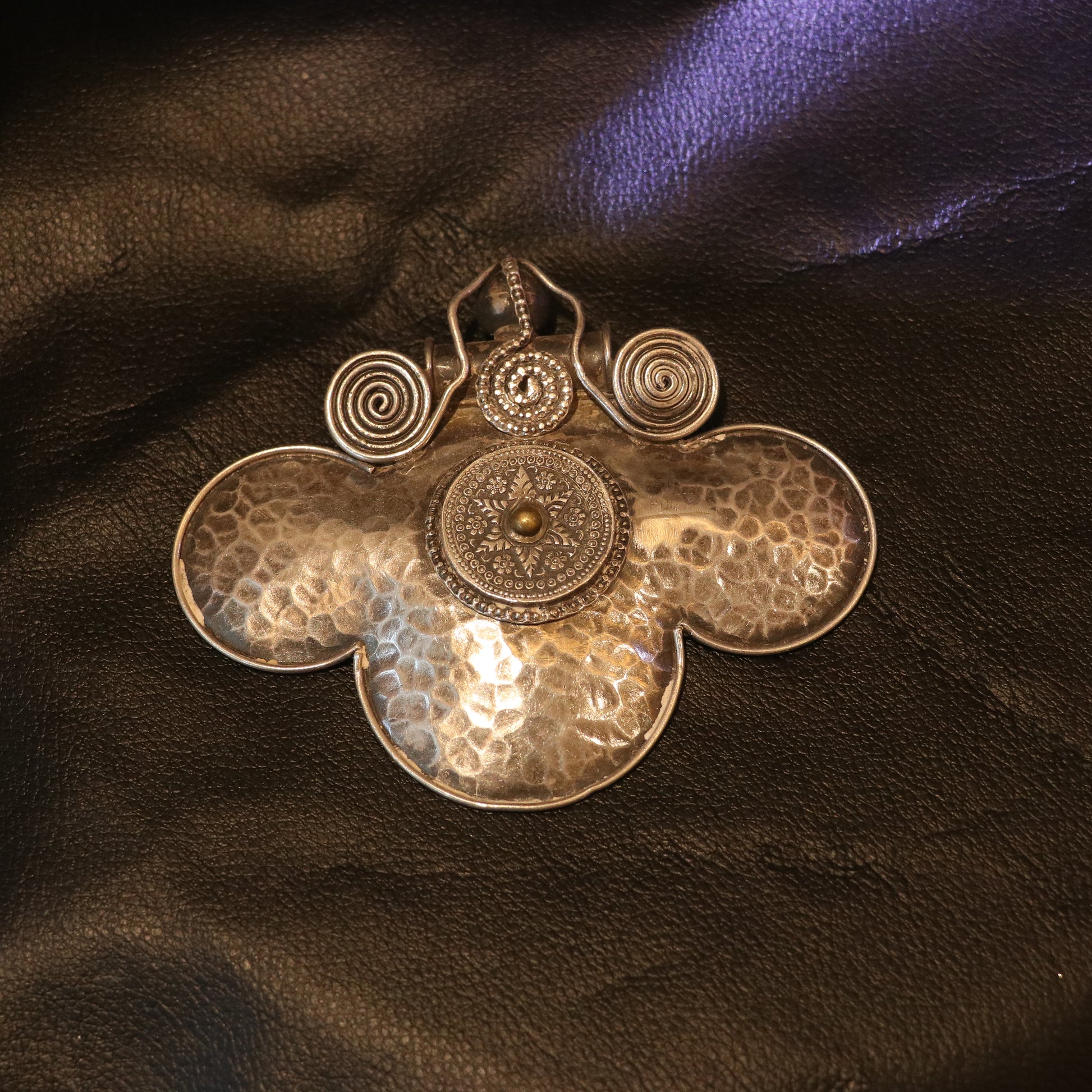 HANDCRAFTED SILVER PENDANT WITH A HAMMERED TEXTURE