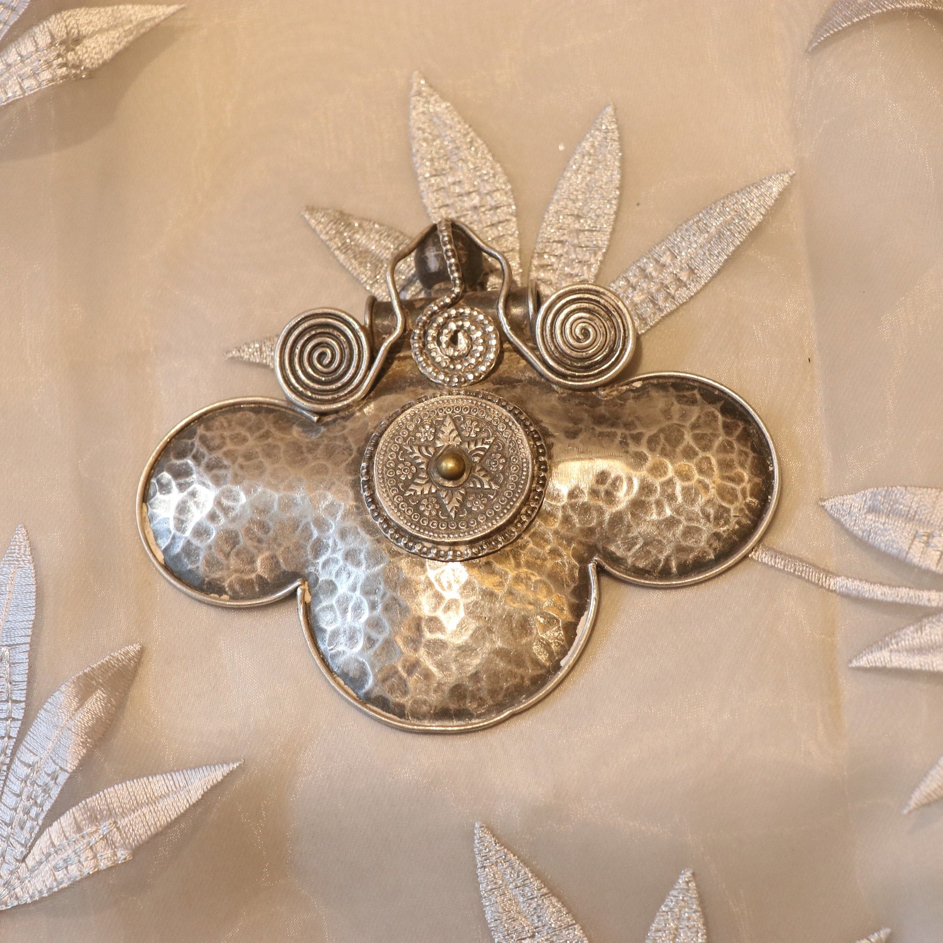 HANDCRAFTED SILVER PENDANT WITH A HAMMERED TEXTURE